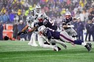 Collins (58) making a takedown during a November 2019 game (Photo: Getty)